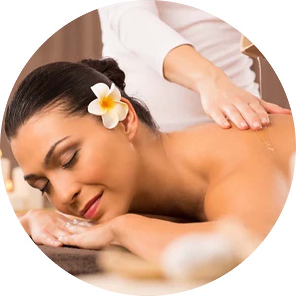 Therapist giving an Abhyanga full body Ayurvedic oil massage