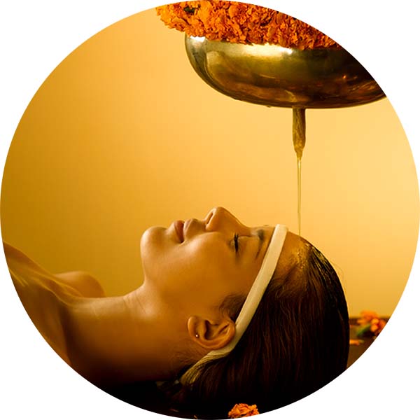 Shirodhara, warm herbal oil poured on the forehead